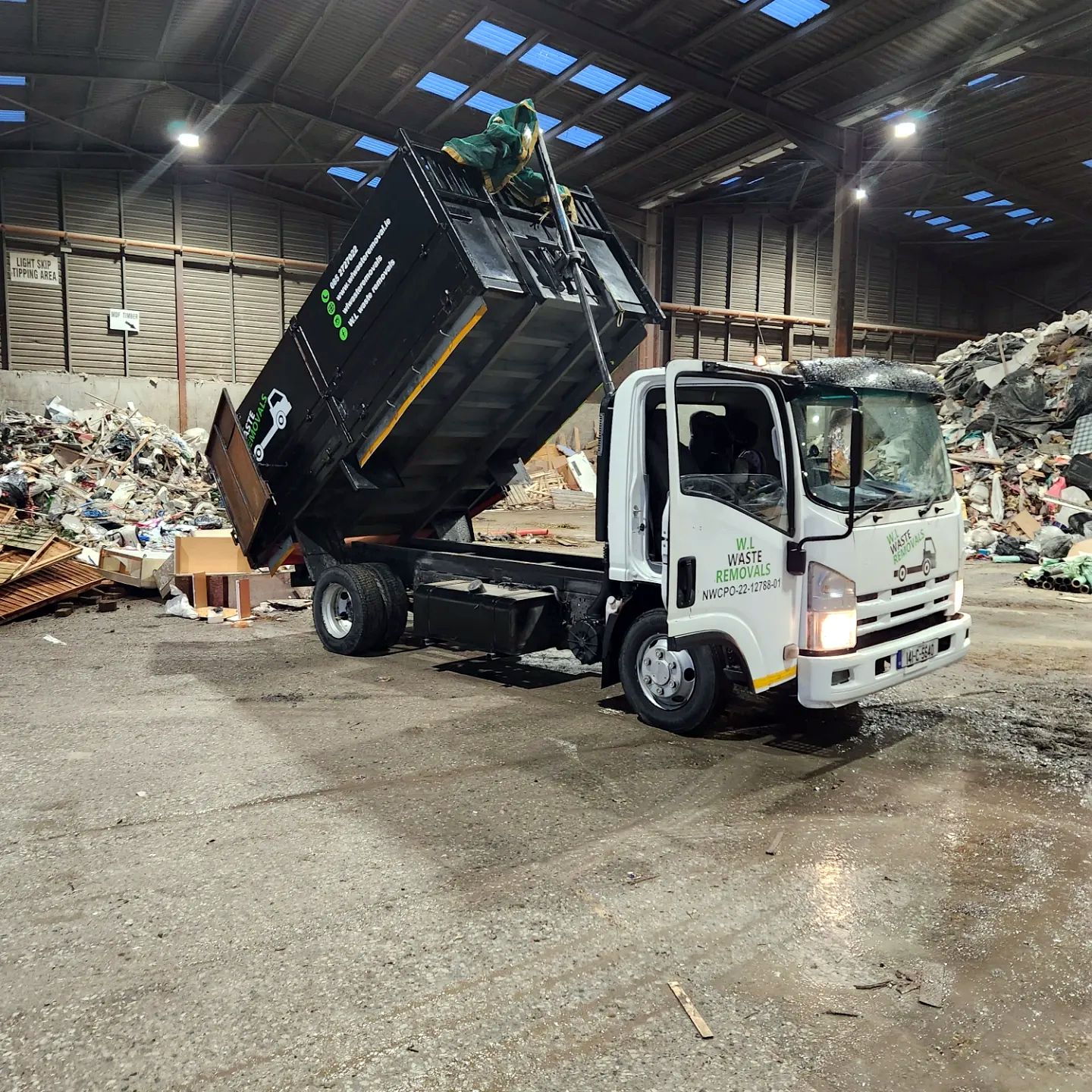 W.L Waste Removals tipper truck unloading at a waste facility
